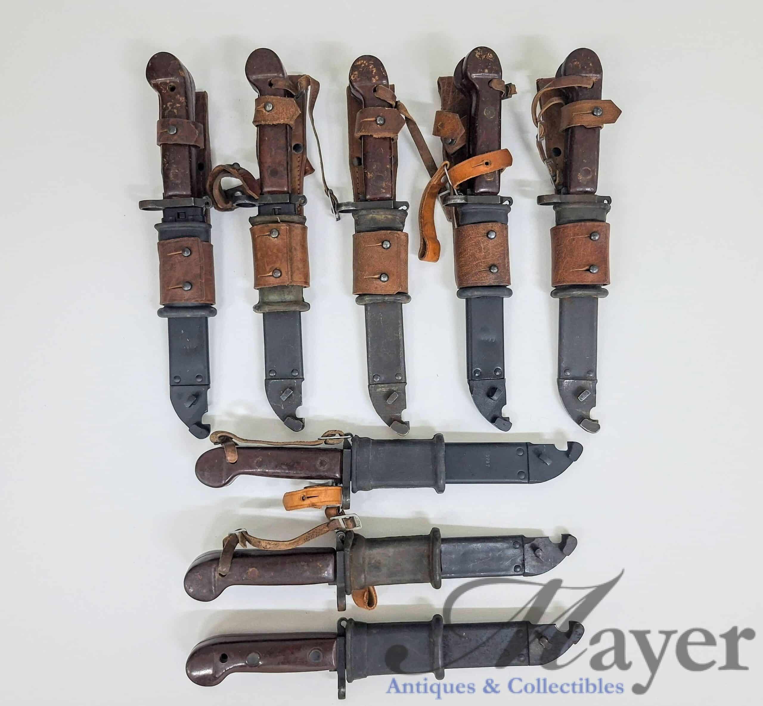 20260608_181942 Israeli military surplus captured Romanian AKM bayonets, probably Type 1 model, most with leather frog.