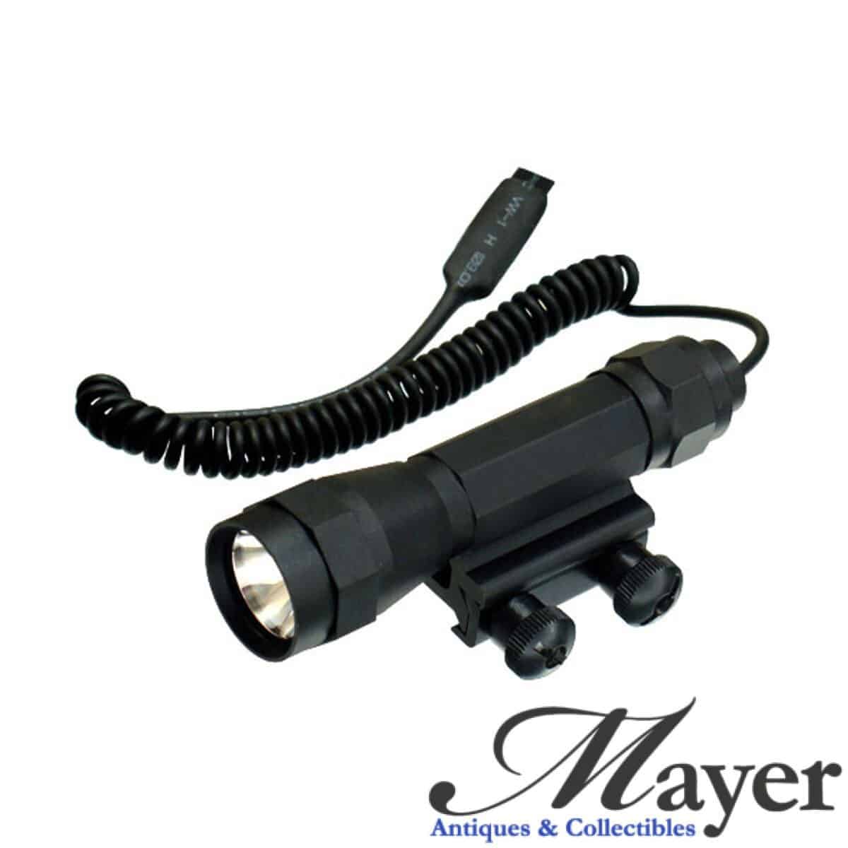 Leapers UTG model LT-TL101 tactical flashlight with integral rifle mount and PTT cable remote pressure on/off switch.
