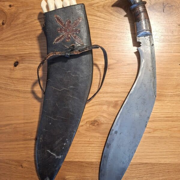 Antique and rare Nepalese Gurkha Kukri knife with set of eight small knives used as tools.